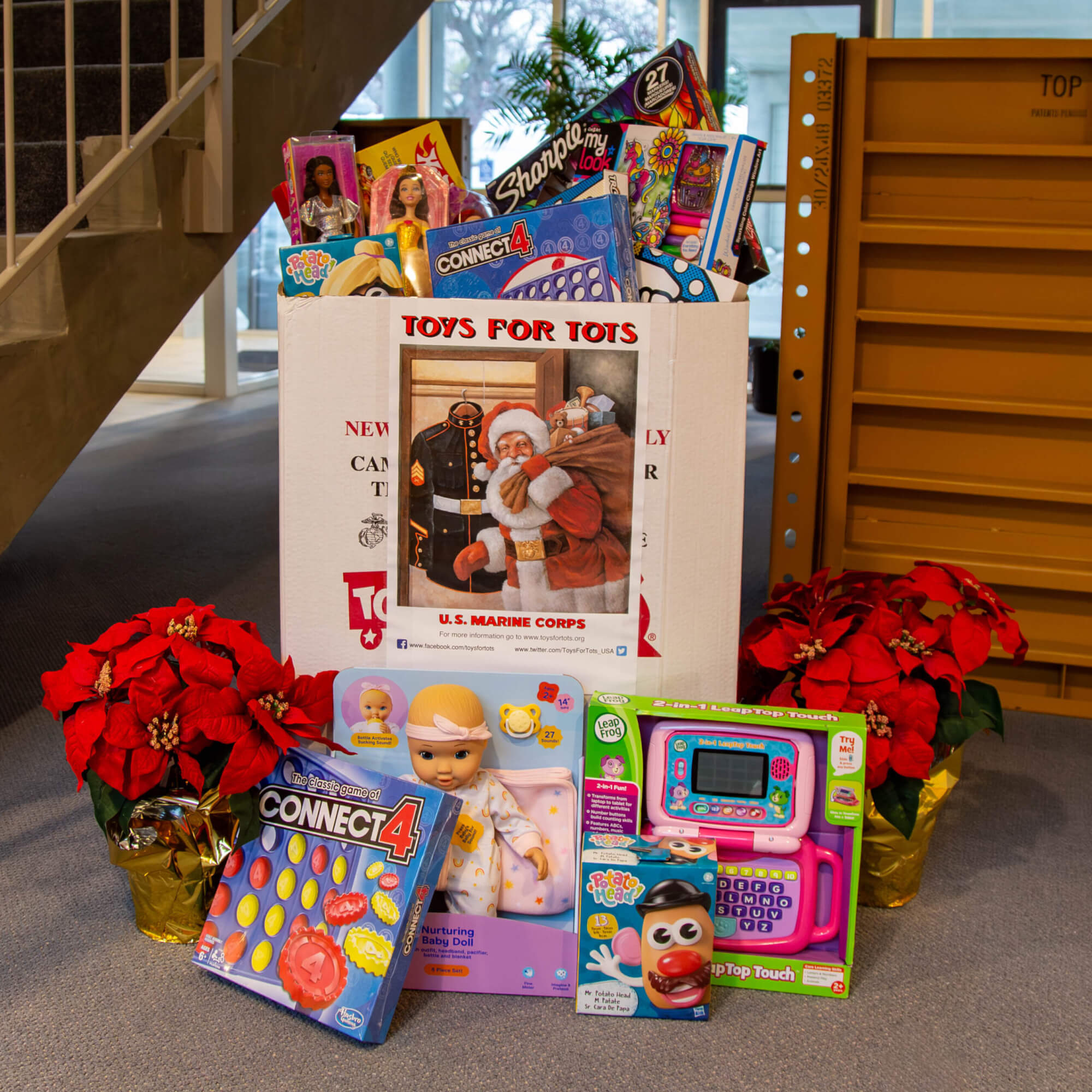 Toys for Tots 2025 contributions from Des Moines team members, giving back to kids in our local community.