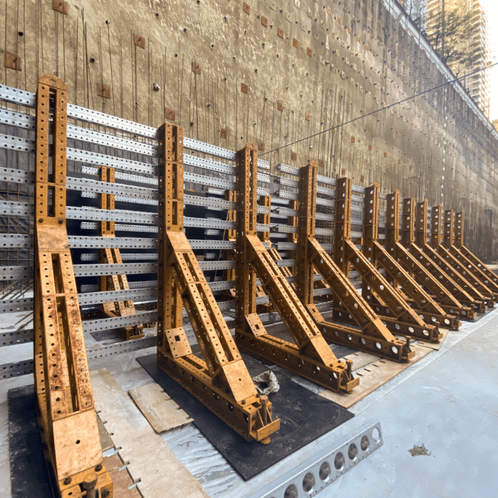 How do you form a one-sided retaining wall without ties? The forming layout was carefully aligned with each plywood joint location, producing the clean, symmetrical lines that define the finished walls 
and reward the contractor’s investment in premium form materials.