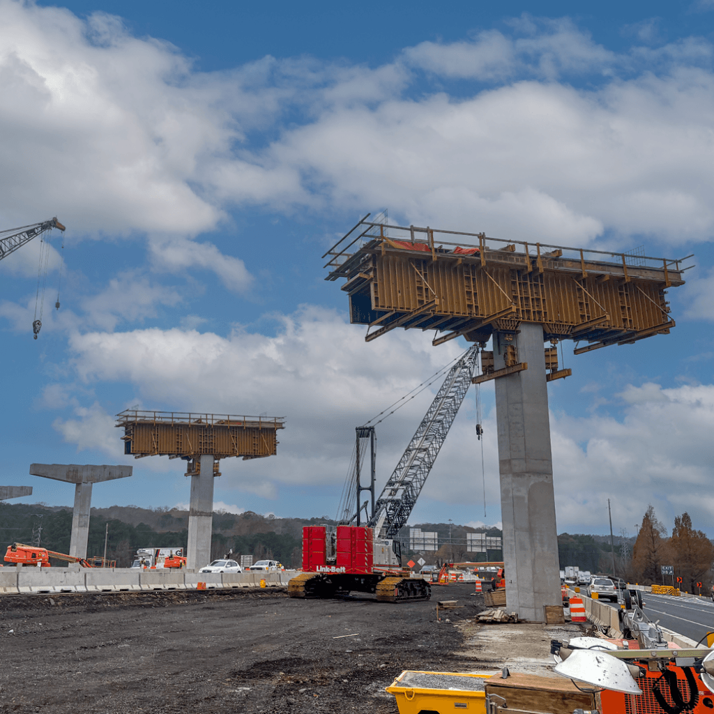 Multiple EFCO SUPER PLATE GIRDER pier caps are set up on top of the finished concrete columns.